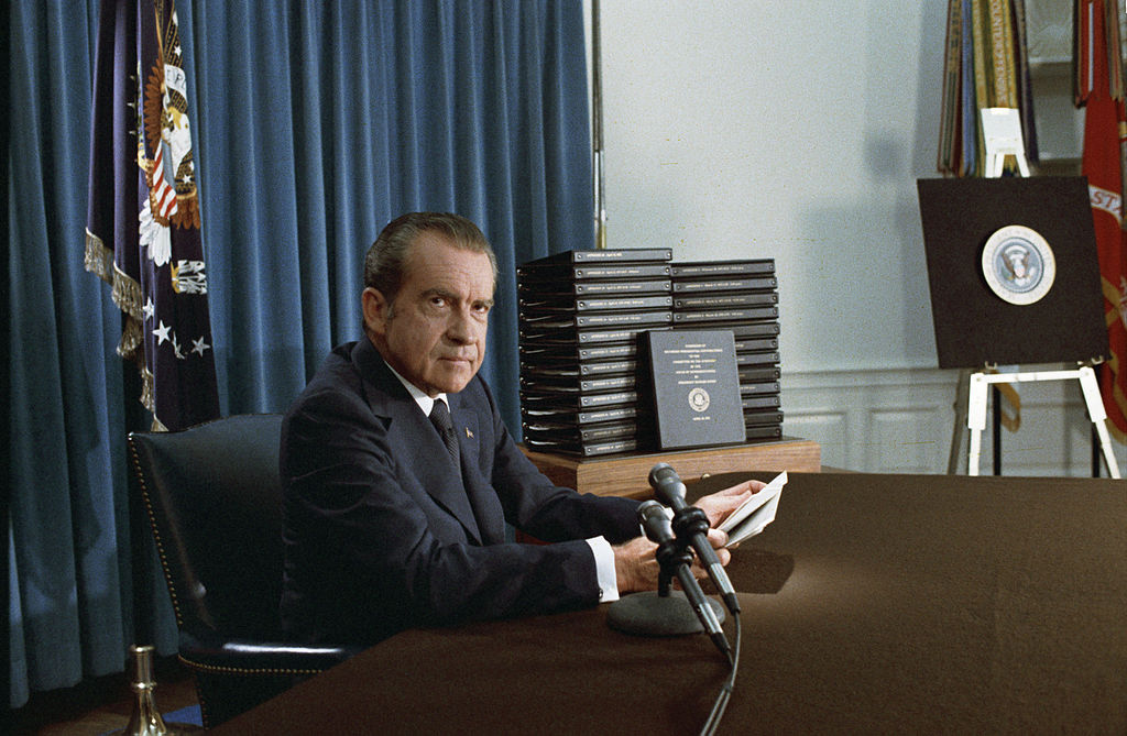 Nixon with edited transcripts of Nixon White House Tape