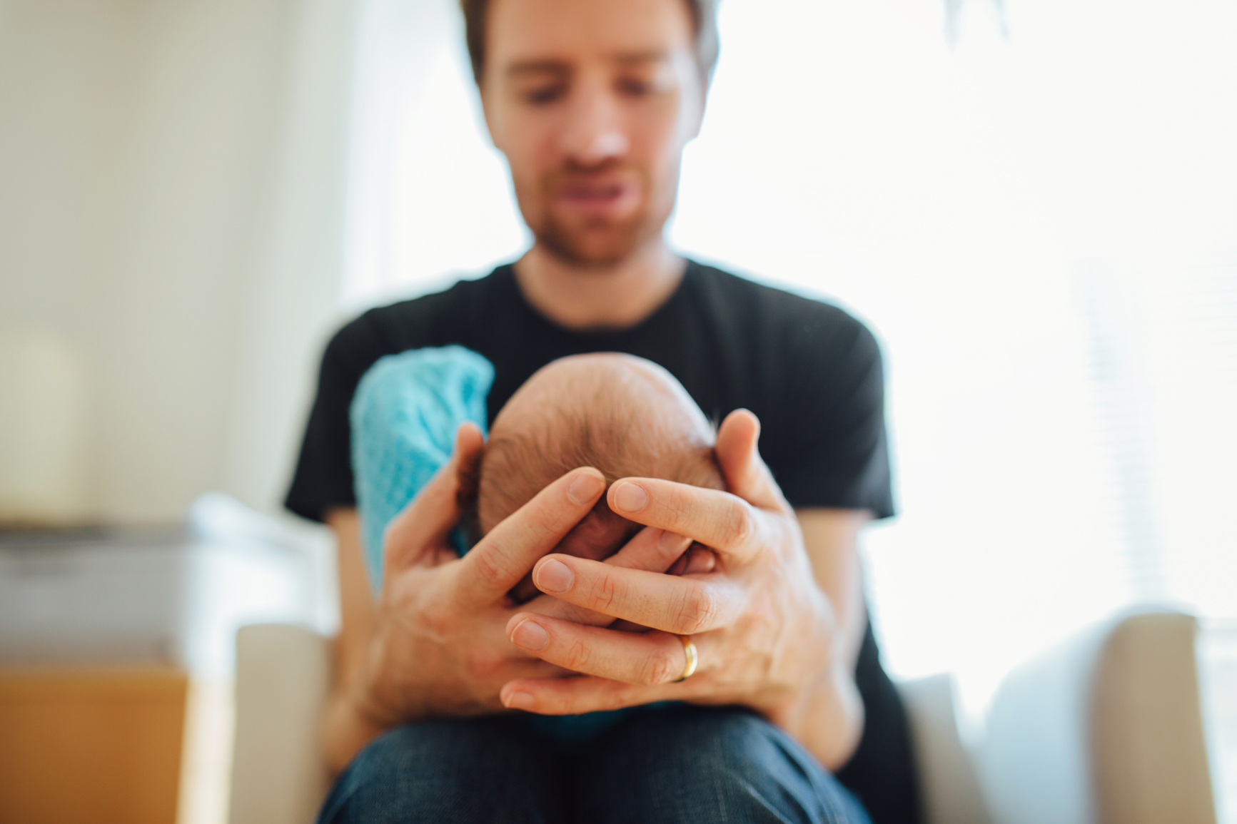 Father holding newborn