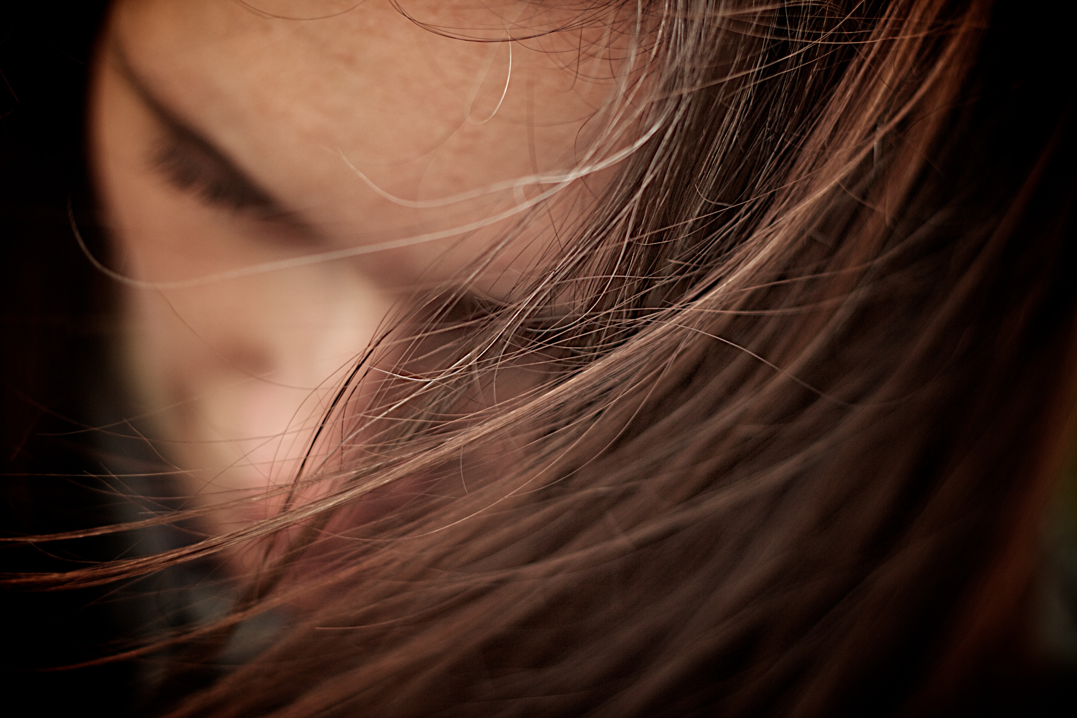 Woman with hair covering her face