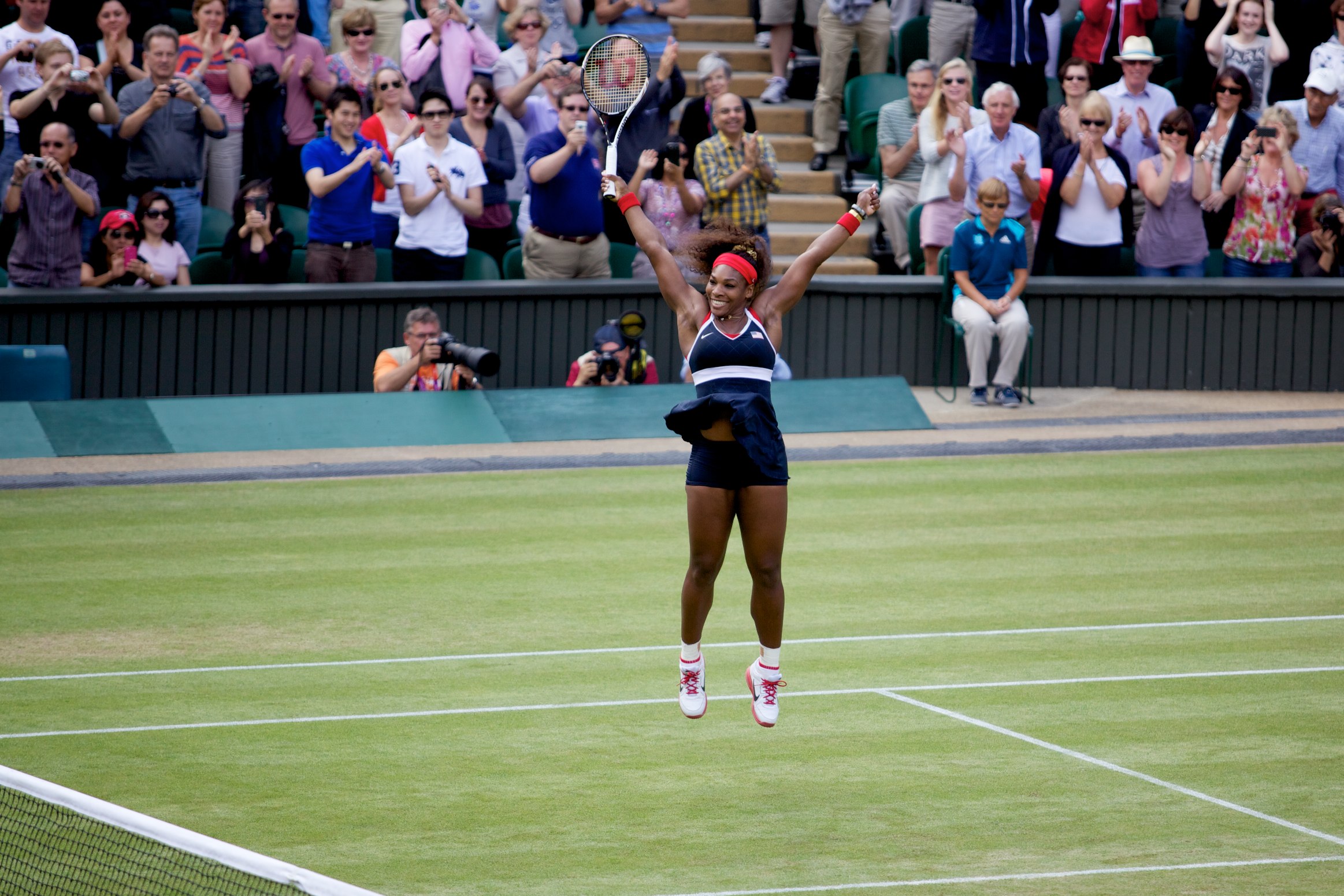 Serena Williams celebrates after winning Olympic gold medal