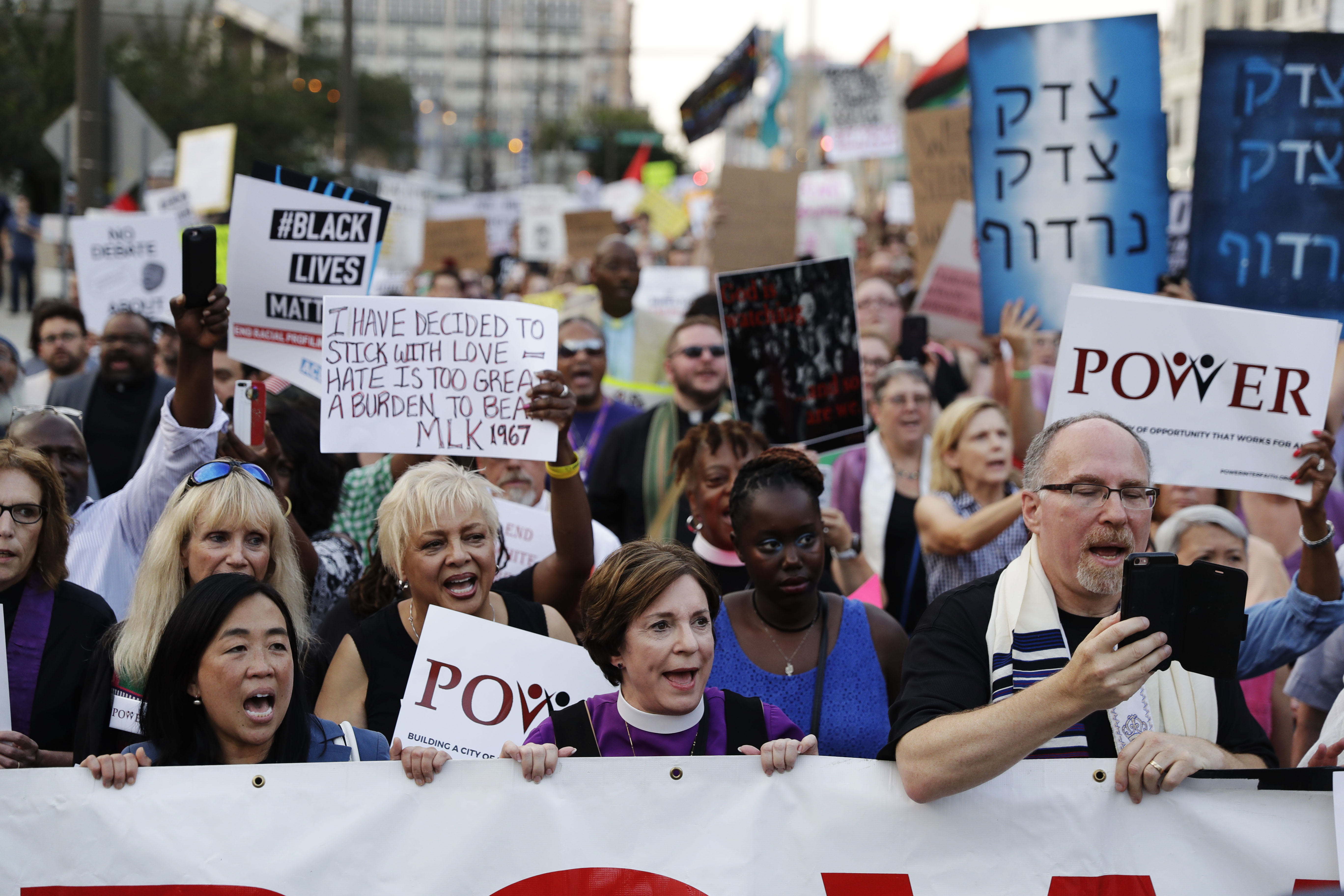 "City Councilwoman Helen Gym, left, marches with protesters as they demonstrate in response to a white nationalist rally held in Charlottesville, Va., over the weekend, in Philadelphia." 