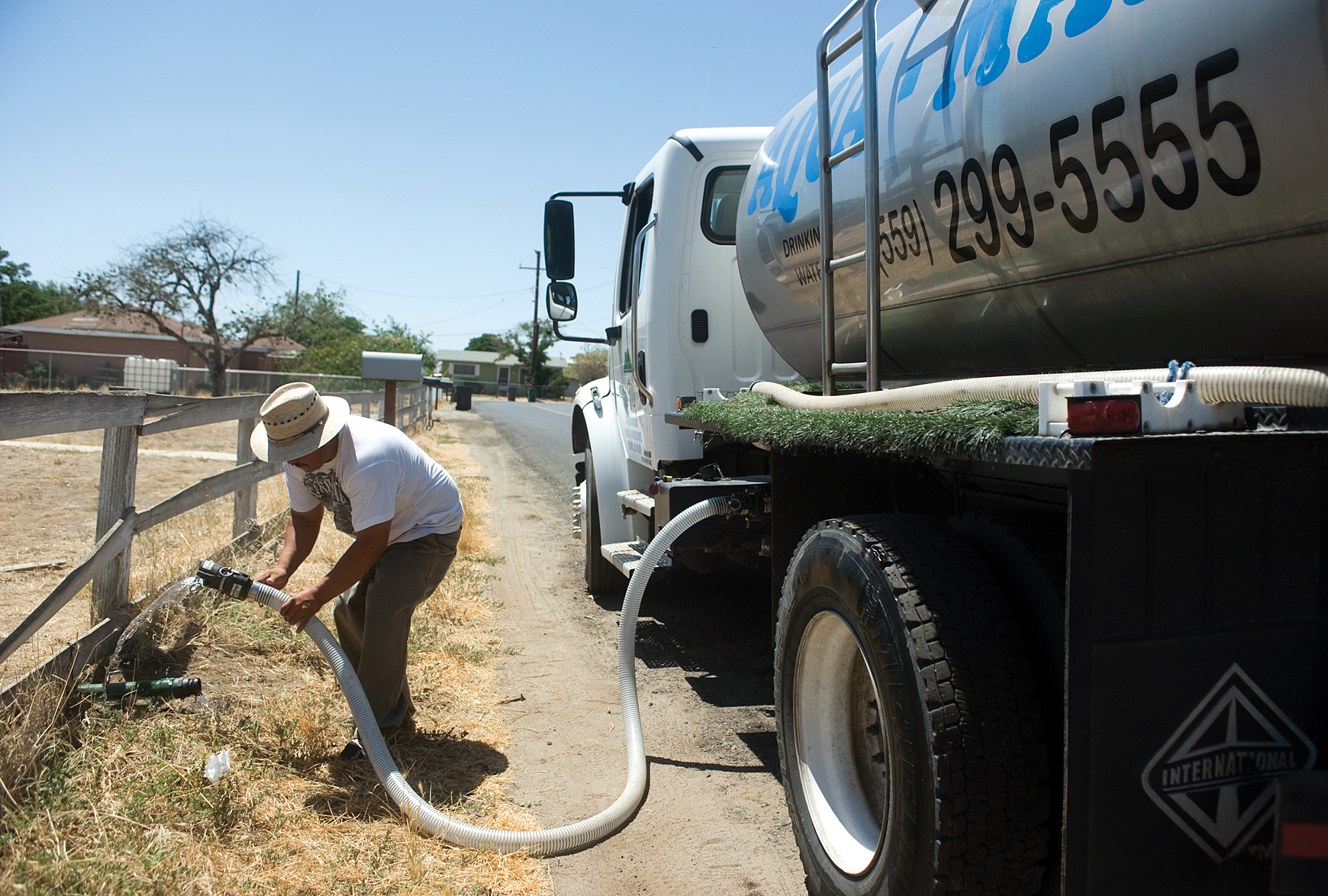 Man uses water truck in East Porterville, California