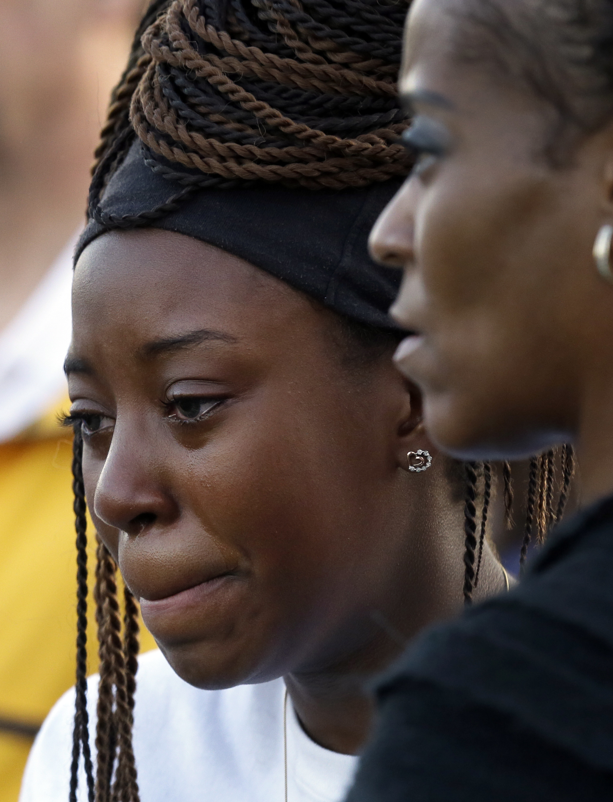 "Ashuntae Coleman, 14, left, cries as her mother Demetria Brown, right, embraces her during a candle light vigil for Jordan Edwards in Balch Springs, Texas, Thursday, May 4, 2017. "