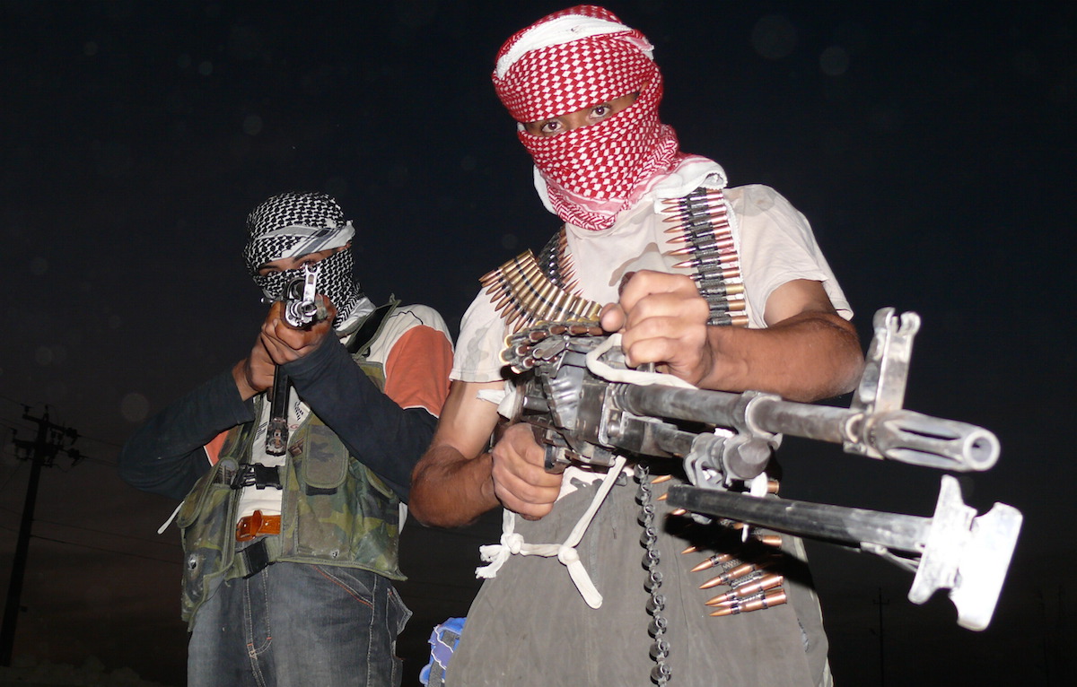 Iraqi insurgents with guns