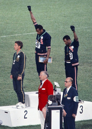 Tommie Smith and John Carlos raise their fists at the 1968 Olympics. 