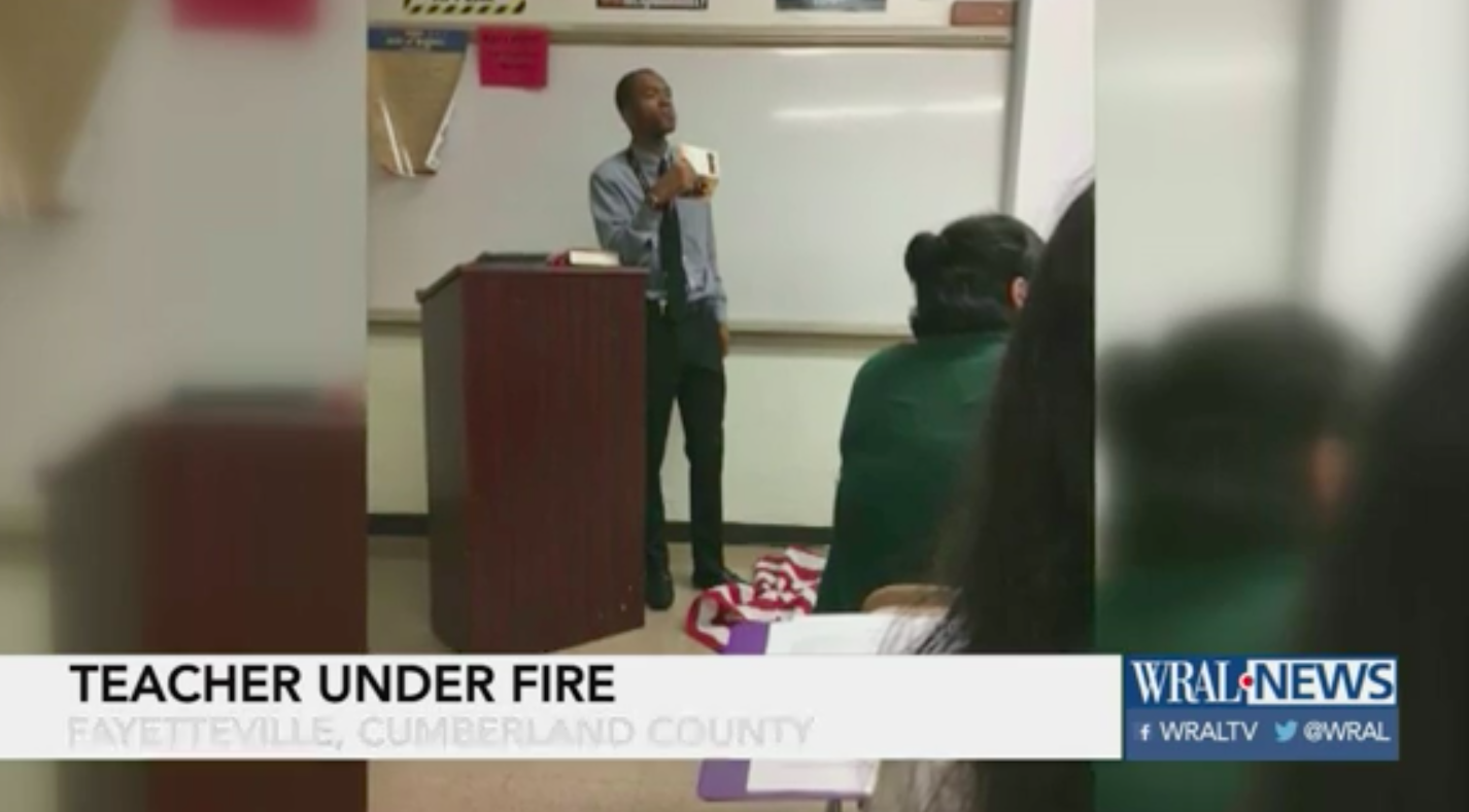 Teacher steps on the flag to teach about the First Amendment. 