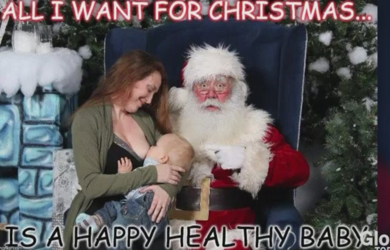 Mom breastfeeding in Santa photo