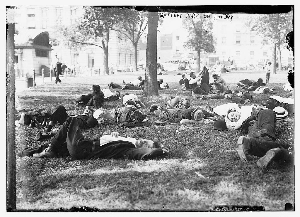 People sleeping in the shade in the early 20th century.