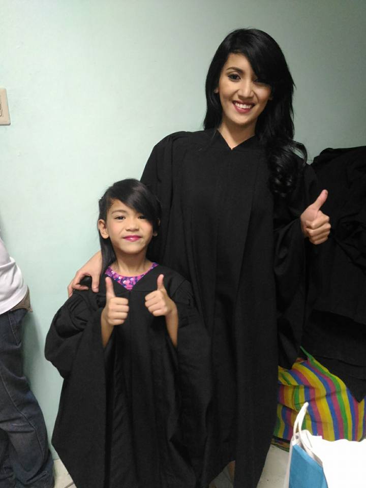 Vin-zl Vicente with daughter in graduation robes