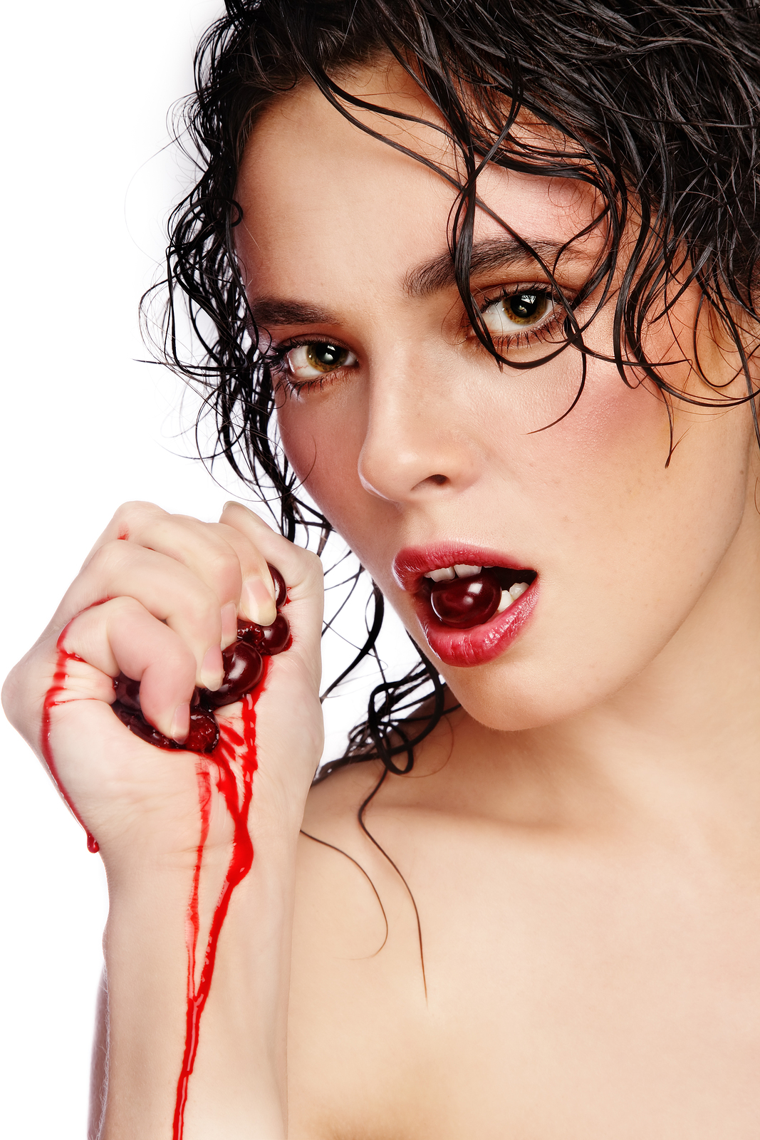 woman eating cherries in her mouth