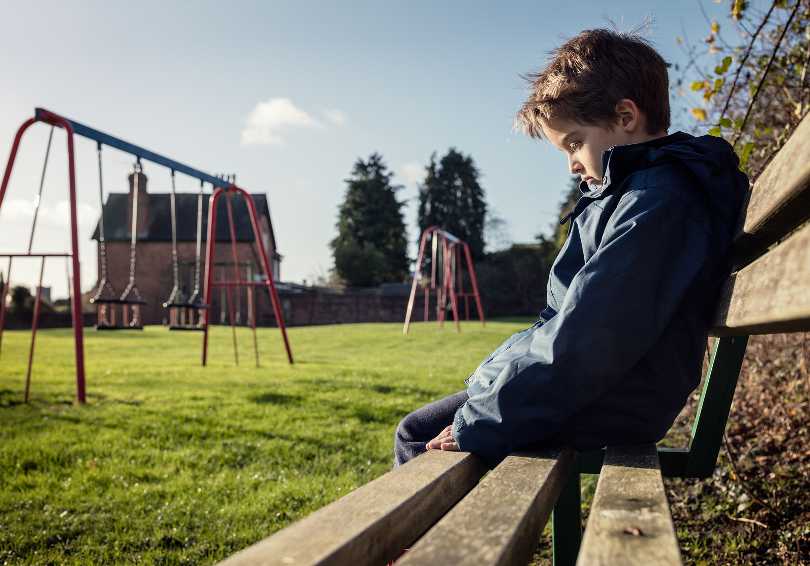 Child sitting on a bench