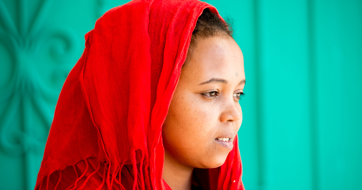 african-arabian-girl-wearing-red-scarf-covering-her hair-and-body