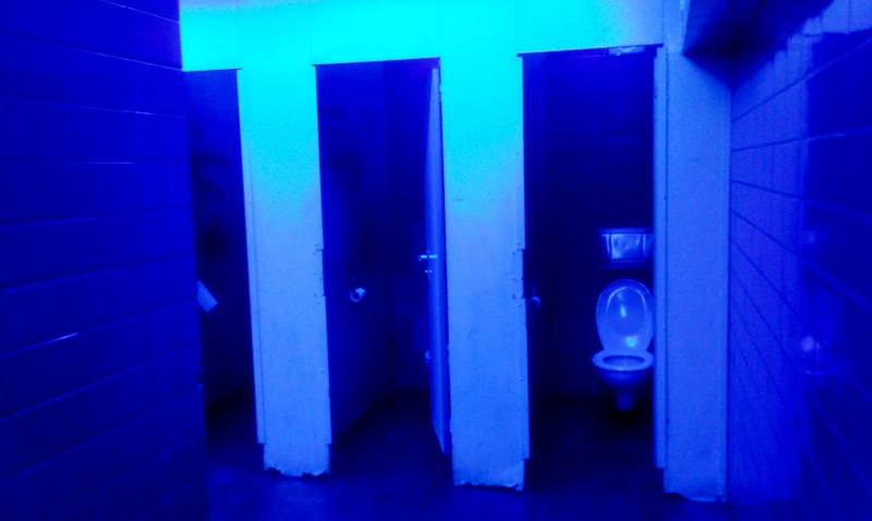 Blue lighting in public restrooms