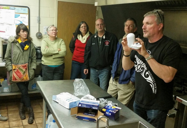 Crossing Water volunteer giving a demonstration on filter use.