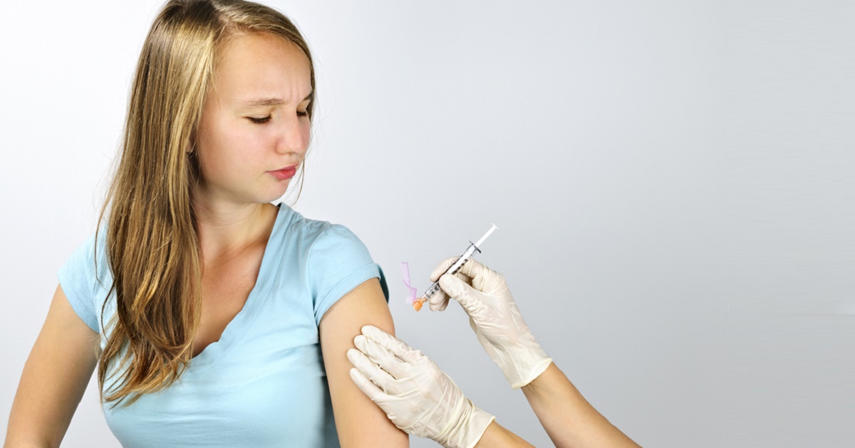Young woman getting flu shot