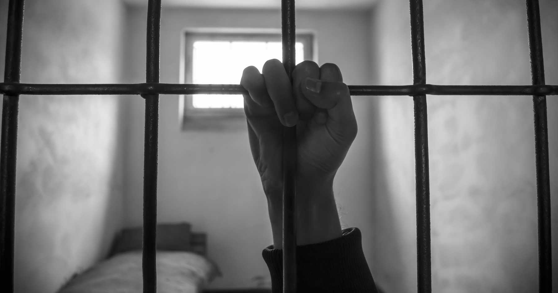 Prisoner's hand on the bars