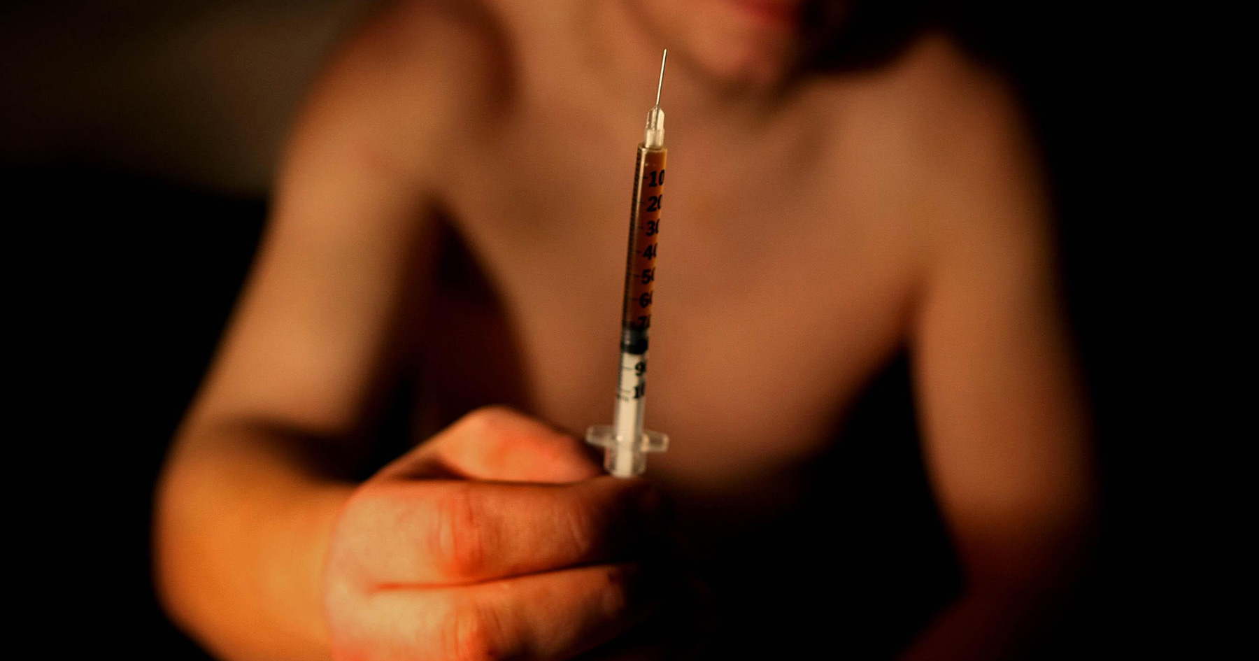 Man offering heroin needle