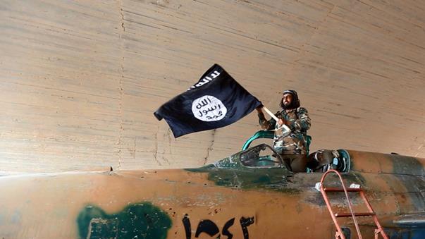 isis-fighter-waves-isis-flag-from-vehicle