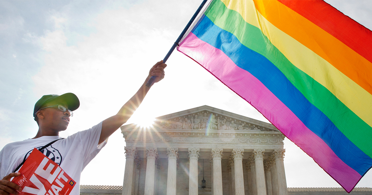 man-waving-rainbow-flag-in-support-gay-marriage