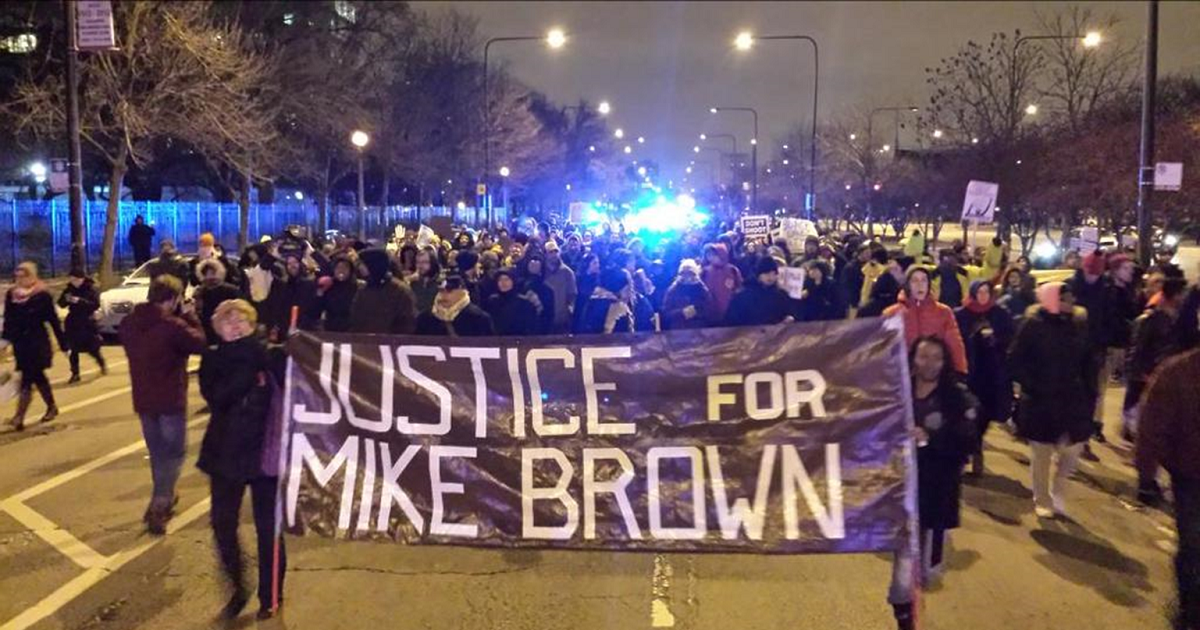 Protesters march in Chicago following grand jury decision not to indict Darrell Wilson in shooting death of Mike Brown
