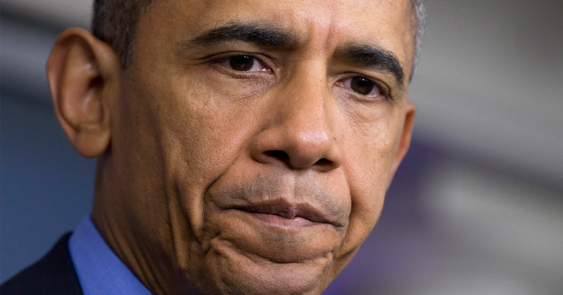 Barack Obama pauses during briefing about Charleston