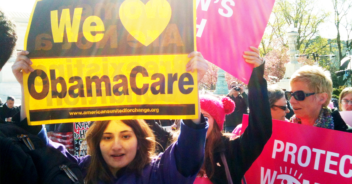 woman-holding-obamacare-sign