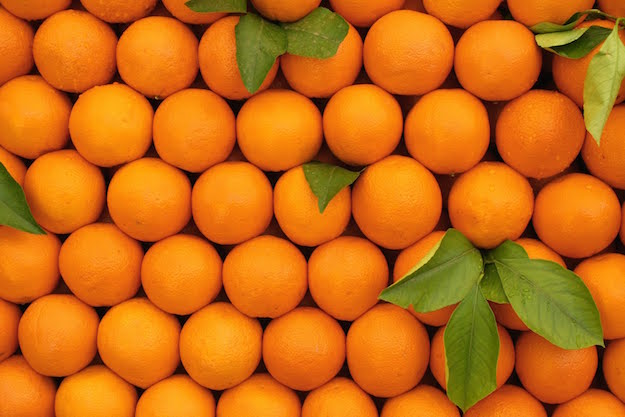 Piles of Navel Oranges