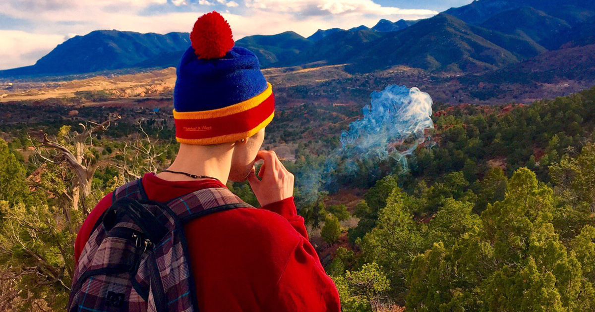 man-smoking-on-mountain