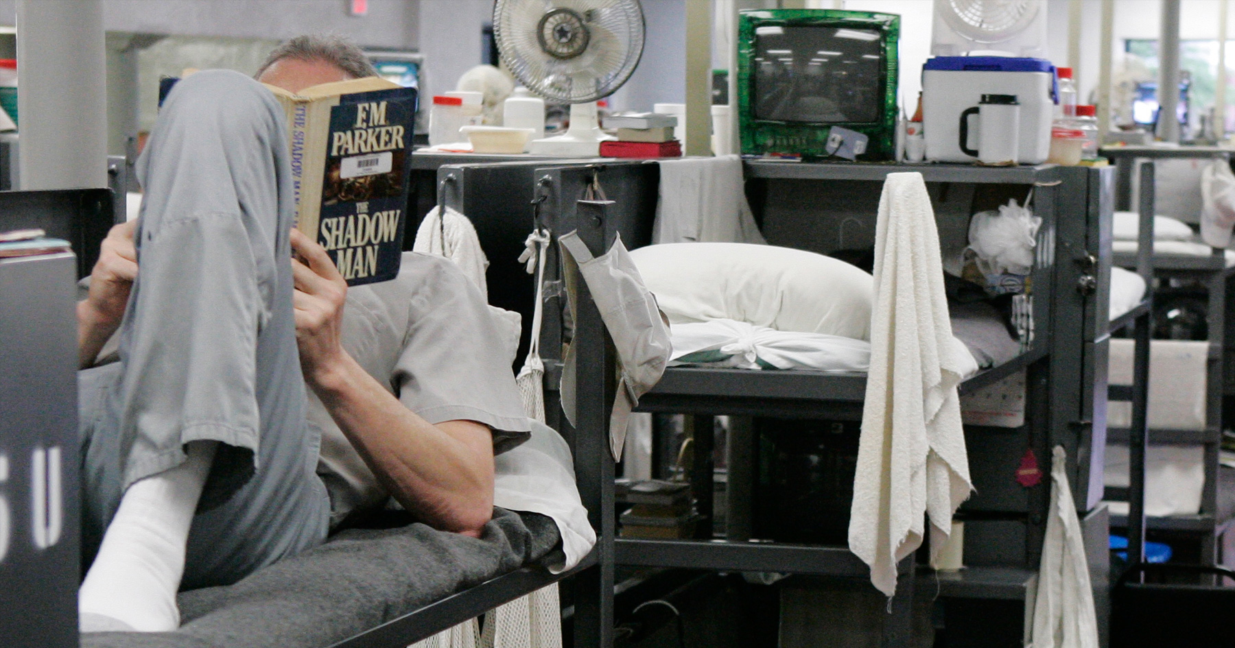 Inmate reading in prison