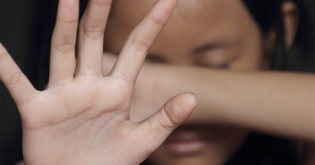 girl-holding-palm-in-front-of-face