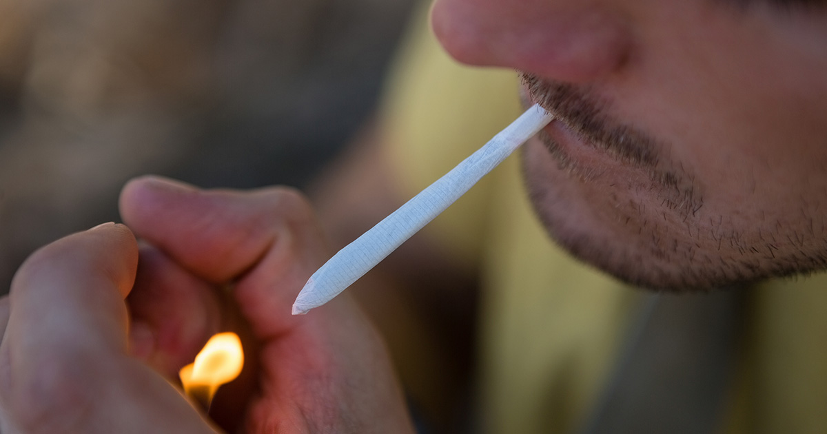 someone-smoking-joint-lighter
