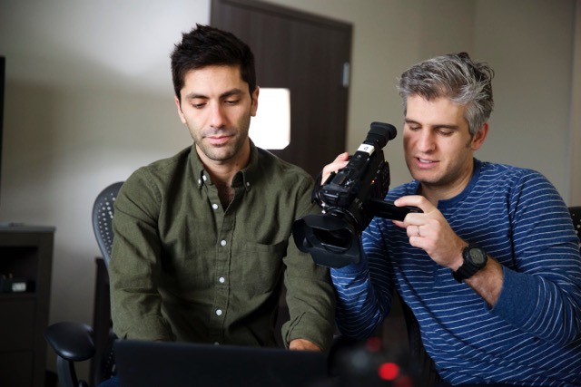 Nev Schulman looking at his computer