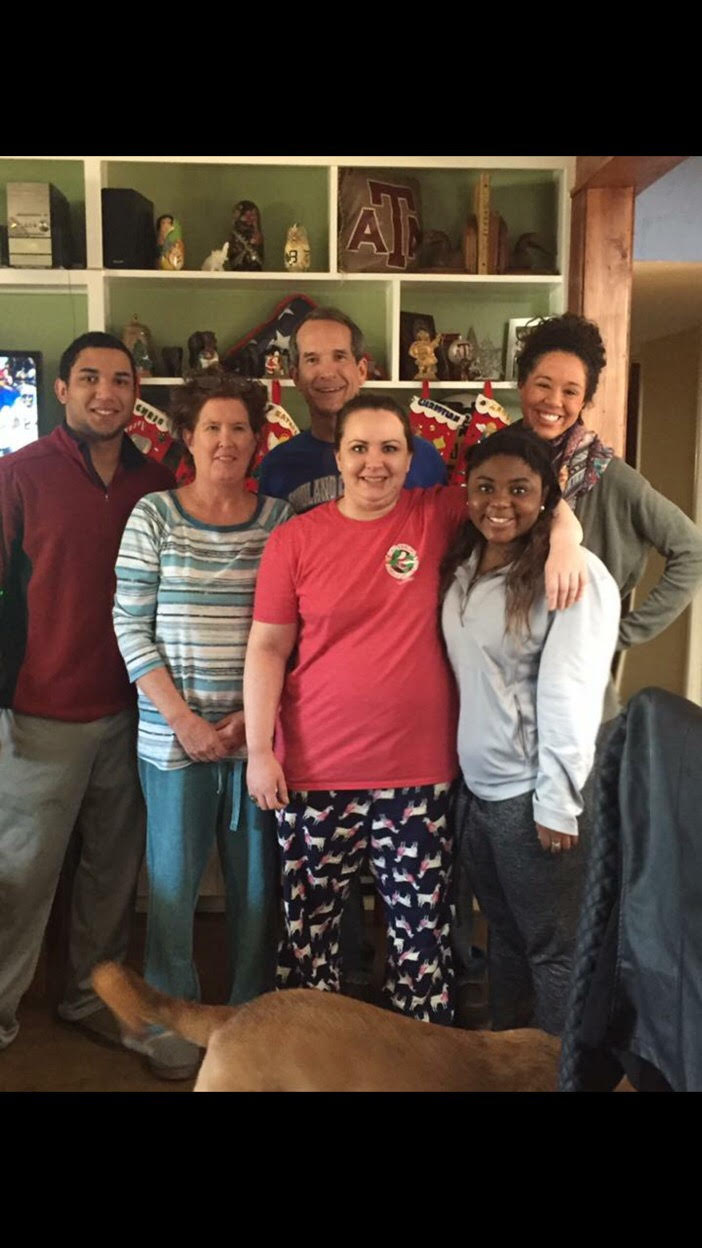 Maddie Whigham (front, far right) poses with her family. 