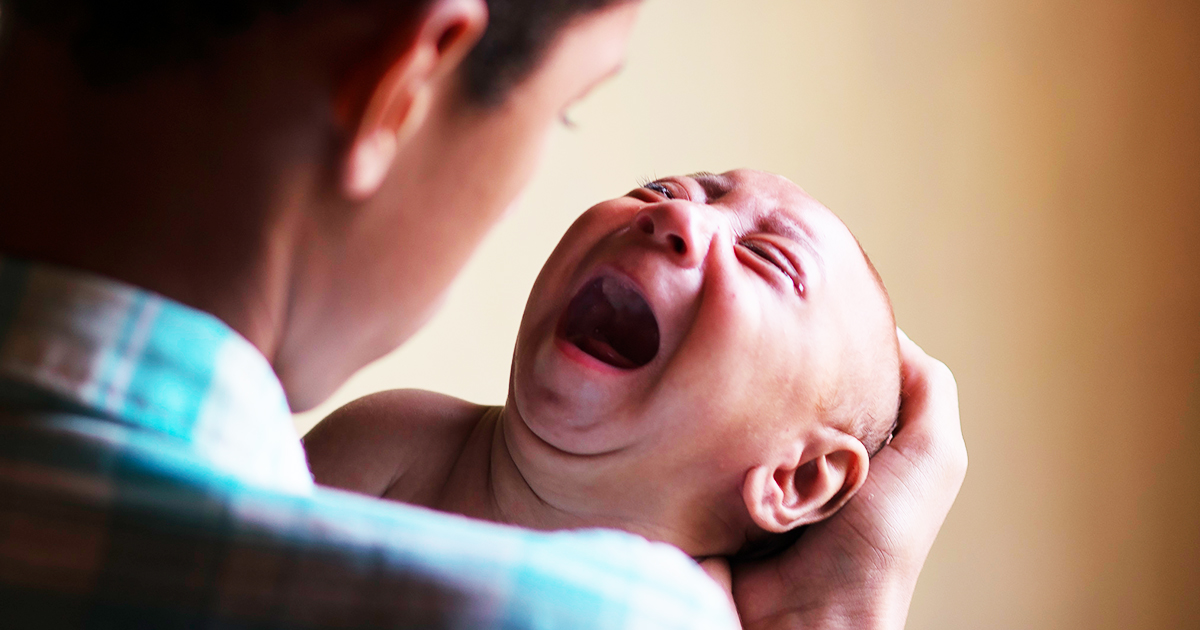 crying-baby-with-small-head-due-to-zika-virus